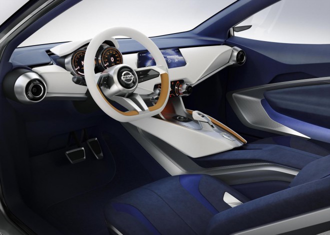 The interior is extremely refined, airy and modern. Ultra-light seats with a visible aluminum structure and a cut steering wheel with a small diameter are special features. 
