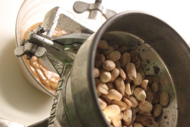 Rok grinds roasted peanuts by hand