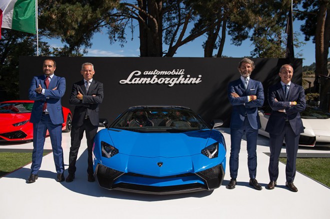 The proud Lamborghini team with their latest muscle car.